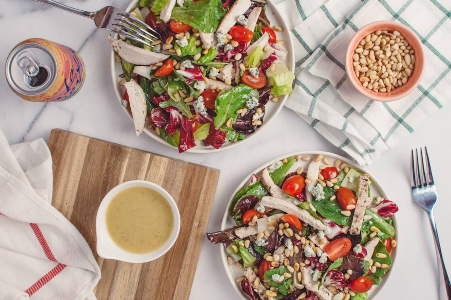 Assorted salad dressings lined up beside fresh salad bowls, highlighting salad dressing nutrition carbs calories sugar differences