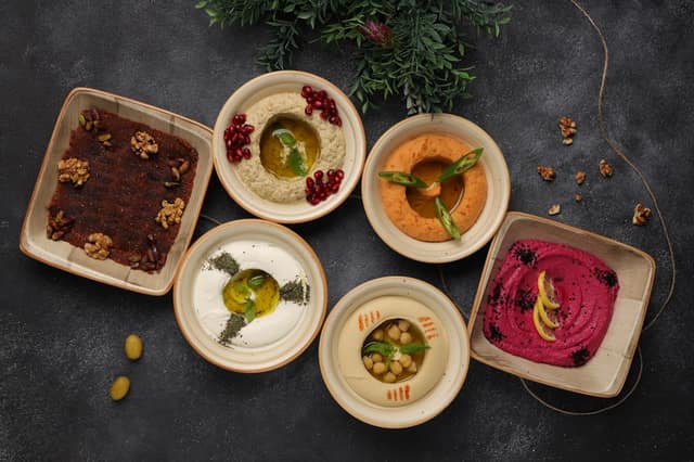 Colorful Middle Eastern sauces in bowls showing hidden carbs Middle Eastern sauces low-carb dieters should know about